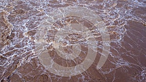 Aerial view of water released from the drainage channel of the concrete dam is a way of overflowing water in the rainy season.