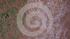 Aerial view of water released from the drainage channel of the concrete dam is a way of overflowing water in the rainy season.