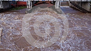 Aerial view of water released from the drainage channel of the concrete dam is a way of overflowing water in the rainy season.