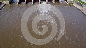 Aerial view of water released from the drainage channel of the concrete dam is a way of overflowing water in the rainy season.