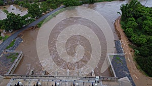 Aerial view of water released from the drainage channel of the concrete dam is a way of overflowing water in the rainy season.