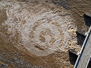 Aerial view of water released from the drainage channel of the concrete dam is a way of overflowing water in the rainy season. Top