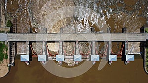 Aerial view of water released from the drainage channel of the concrete dam is a way of overflowing water in the rainy season. Top