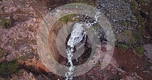 Aerial view of waterfall at coast of Barents Sea