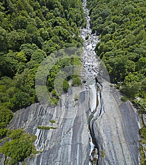 Aerial view of a waterfall in Val di Mello. Val Masino, Valtellina, Sondrio. Italy