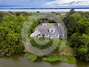 Aerial view of home on wooded property