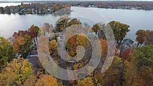 Aerial view of waterfront houses on a lake in late autumn