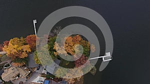 Aerial view of waterfront houses on a lake in late autumn