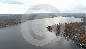 Aerial view of waterfront houses on a lake in late autumn