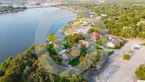 Aerial view waterfront residential and rental properties houses along Brazos River in downtown Granbury, Texas