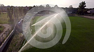 Aerial view of watering the lawn of a football field