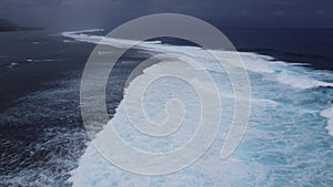 Aerial view of waves and lagoon at Rarotonga