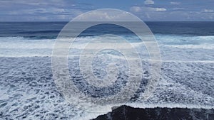 Aerial view of waves and lagoon at Rarotonga