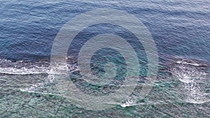 Aerial view of waves on the ocean shore