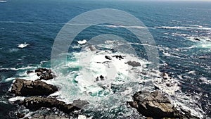 Aerial view of waves and rocks in Big Sur coastline