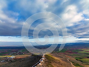 Aerial view of whiite windmills of Consuegra in Castilla-La Mancha, Toledo, Spain