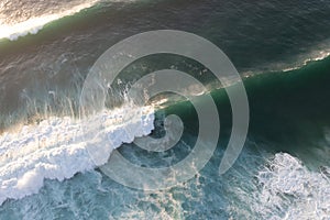 Aerial view of the white beach with waves Big ocean wave Versatile use. Holiday concept