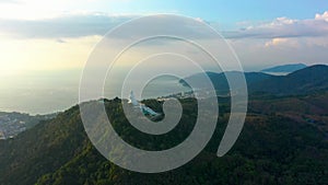 Aerial view of White Big Buddha Statue Temple on hilltop, Phuket, Thailand