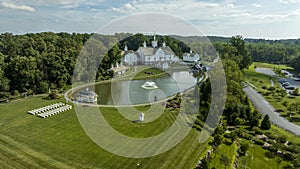 Aerial View White Buildings With Orthodox Architectural Features, Symmetrical Pond With Fountains