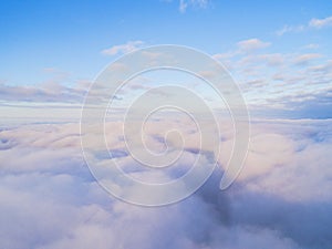 Aerial view White clouds in blue sky. Top view. View from drone. Aerial bird`s eye view. Aerial top view cloudscape. Texture of cl