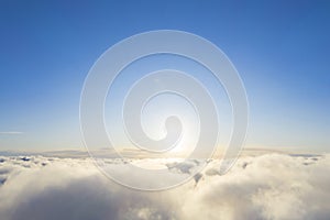 Aerial view White clouds in blue sky. Top fly. Looking from the drone. Aerial bird`s eye view. Aerial top view cloudscape. Textur