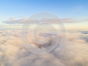 Aerial view White clouds in blue sky. Top view. View from drone. Aerial bird`s eye view. Aerial top view cloudscape. Texture of c