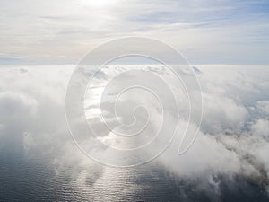 Aerial view White clouds in blue sky. Top view. View from drone. Aerial bird`s eye view. Aerial top view cloudscape. Texture of cl