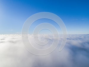 Aerial view White clouds in blue sky. Top view. View from drone. Aerial bird`s eye view. Aerial top view cloudscape. Texture of cl