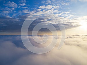 Aerial view White clouds in blue sky. Top view. View from drone. Aerial bird`s eye view. Aerial top view cloudscape. Texture of cl