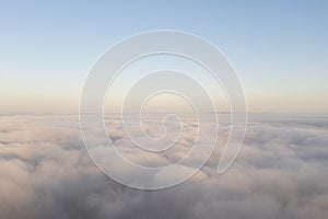 Aerial view white clouds in blue sky. View from drone. Aerial top view cloudscape. Texture of clouds. View from above. Panorama