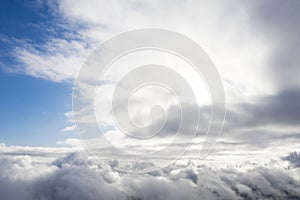 Aerial view white clouds in blue sky. View from drone. Aerial top view cloudscape. Texture of clouds. View from above. Sunrise or