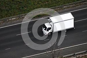 Aerial View of White Cold Storage Delivery Truck on Highway
