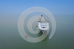 Aerial view of White luxury cruise ship docked in beautiful Cari