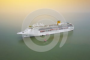 Aerial view of White luxury cruise ship docked in beautiful Cari