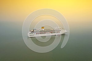 Aerial view of White luxury cruise ship docked in beautiful Cari