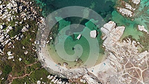 Aerial view of white sand beach, blue sea, marine vegetation,waves,trees and white rocks. abstract sea green shades