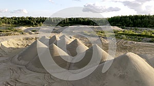 The aerial view of the white sand hills in the quarry