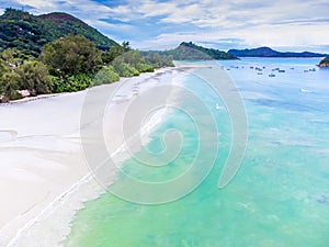Aerial view of white sand and turquoise water in Anse Volbert beach