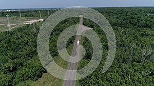 Aerial view of white truck passing busy highway