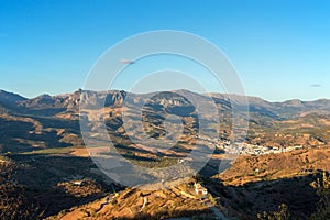 Aerial view of white village in Andalucian landscape, Spain