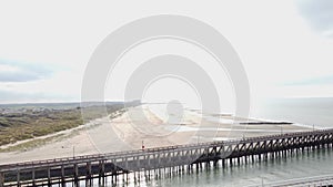 Aerial view of the white wooden pier in the town of Blankenberge