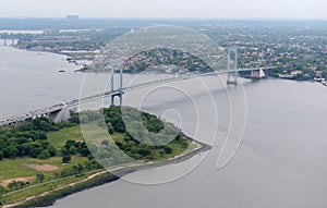 Aerial view of Whitestone Bridge with traffic and Trump golf course, New York City