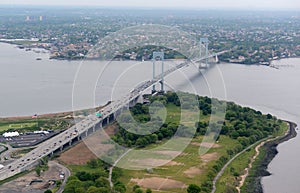 Aerial view of Whitestone Bridge with traffic and Trump golf course, New York City