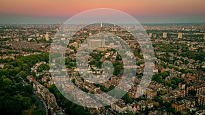 Aerial view of the Whitestone Walk, Hampstead with tall buildings and trees at sunset