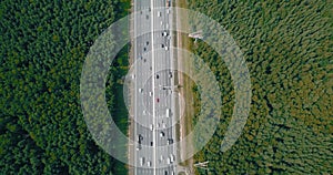 Aerial view on a wide highway with heavy traffic.