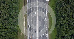 Aerial view on a wide highway with heavy traffic. Time lapse.