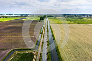 Aerial view of wide open farm lands and canals in the Netherlands photo