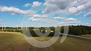 Aerial View of Wind Farm or Wind Park, With High Wind Turbines for Generation Electricity. Green Energy Concept