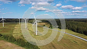 Aerial View of Wind Farm or Wind Park, With High Wind Turbines for Generation Electricity. Green Energy Concept