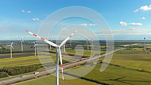 Aerial view of wind turbines farm and agricultural fields. Austria.